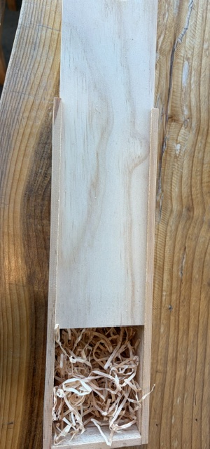 Wooden box with wood wool - upgrade your gifting by adding one of these